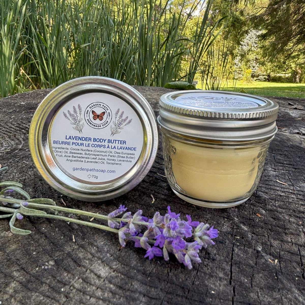 Lavender Body Butter in glass jar with sprig of fresh lavender