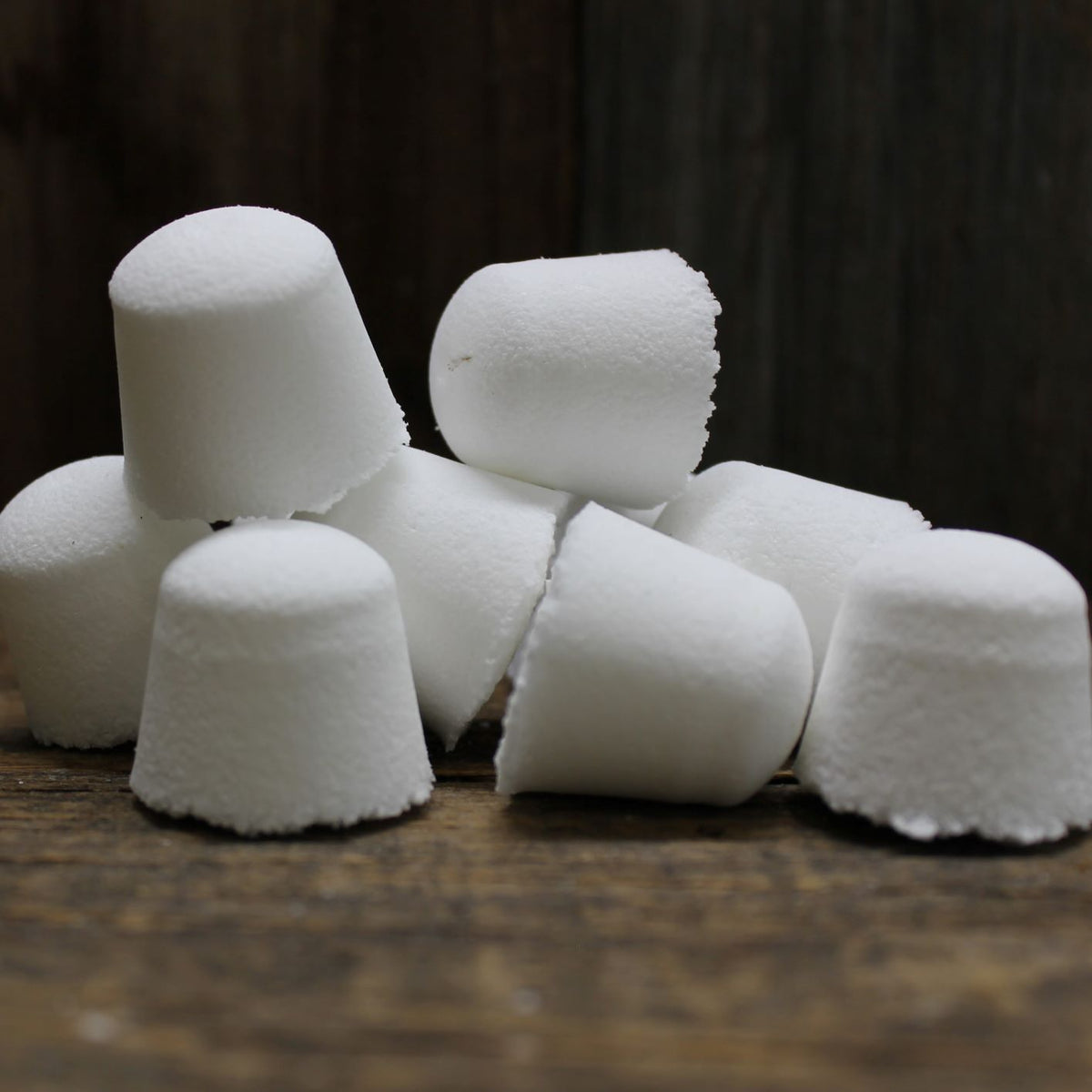 Eight Garden Path Homemade Soap's toilet bombs in a pile
