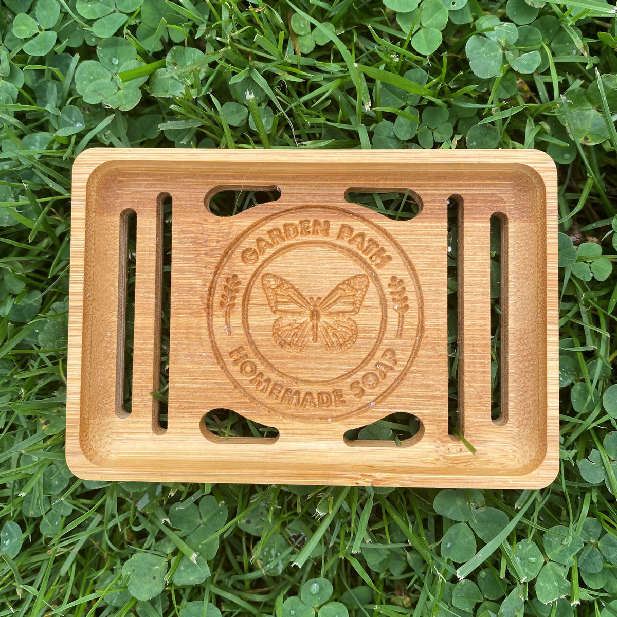 Single Bamboo Soap Dish  with Garden Path Homemade Soap label in the bottom of one side. Slats in the bottom of the dish for drainage.